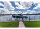 Private boat dock with pathway to the water at 1945 Jamaica Way, Punta Gorda, FL 33950