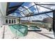 Enjoy this screened pool and spa with a view at 1945 Jamaica Way, Punta Gorda, FL 33950