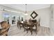 Elegant dining room with hardwood floors and access to a relaxing patio at 1945 Jamaica Way, Punta Gorda, FL 33950