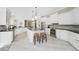 Spacious kitchen featuring white cabinetry, granite countertops, and an island at 1945 Jamaica Way, Punta Gorda, FL 33950