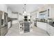 Spacious kitchen featuring a large island with wine storage and stainless steel appliances at 1945 Jamaica Way, Punta Gorda, FL 33950