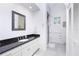 Bathroom with single sink vanity, granite countertop, and shower at 1945 Jamaica Way, Punta Gorda, FL 33950