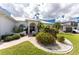 Front entry of a two-story house with landscaping and walkway at 1945 Jamaica Way, Punta Gorda, FL 33950