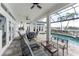 Inviting poolside patio with seating, overlooking the canal at 1945 Jamaica Way, Punta Gorda, FL 33950