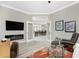 Relaxing office with hardwood flooring, fireplace, and view into dining area at 1945 Jamaica Way, Punta Gorda, FL 33950