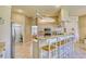 Open kitchen with breakfast bar and view into living area at 21 Par View Pl, Rotonda West, FL 33947