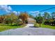 House exterior featuring a two car garage and a well manicured lawn at 21 Par View Pl, Rotonda West, FL 33947