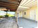 Covered patio with adjacent storage and backyard access at 21218 Gladis Ave, Port Charlotte, FL 33952