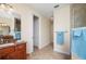 Bathroom with granite vanity, walk-in shower with glass door, and hallway with closet at 2736 Magdalina Dr, Punta Gorda, FL 33950