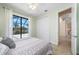 Cozy bedroom featuring screened-in patio view and a closet at 2736 Magdalina Dr, Punta Gorda, FL 33950