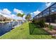 Landscaped backyard with canal access at 2736 Magdalina Dr, Punta Gorda, FL 33950