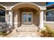 Elegant entryway with double doors and arched detail, creating a welcoming atmosphere at 2736 Magdalina Dr, Punta Gorda, FL 33950