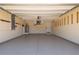 Clean, spacious garage with epoxy floors, ample storage, and room for multiple vehicles at 2736 Magdalina Dr, Punta Gorda, FL 33950