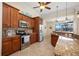 Kitchen boasts stainless steel appliances, granite counters, and wooden cabinets at 2736 Magdalina Dr, Punta Gorda, FL 33950