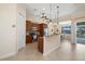Well-equipped kitchen with dark wood cabinetry, stainless steel appliances, and breakfast bar at 2736 Magdalina Dr, Punta Gorda, FL 33950