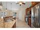Kitchen featuring granite countertops, stainless appliances, tile flooring and a breakfast nook in an open floorplan at 2736 Magdalina Dr, Punta Gorda, FL 33950