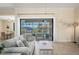 Light-filled living room with sliding glass doors leading to the outdoor pool area at 2736 Magdalina Dr, Punta Gorda, FL 33950