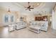 Spacious living room featuring an open layout, tile flooring, and elegant furnishings at 2736 Magdalina Dr, Punta Gorda, FL 33950