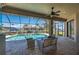 Screened-in patio featuring a swimming pool and canal views at 2736 Magdalina Dr, Punta Gorda, FL 33950