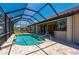 Tranquil screened-in pool with patio offering a peaceful retreat with views of the canal at 2736 Magdalina Dr, Punta Gorda, FL 33950