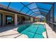 Relaxing screened-in pool with patio and view of the house and interior at 2736 Magdalina Dr, Punta Gorda, FL 33950
