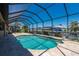 Sparkling screened-in pool offers a refreshing escape with canal views and sunny skies at 2736 Magdalina Dr, Punta Gorda, FL 33950