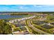Aerial view of community with tennis courts and lakefront at 43050 Greenway Blvd # 614, Punta Gorda, FL 33982