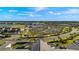 Aerial view of community with tennis courts and golf course at 43050 Greenway Blvd # 614, Punta Gorda, FL 33982
