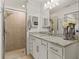 Bathroom with granite countertop and walk-in shower at 43050 Greenway Blvd # 614, Punta Gorda, FL 33982