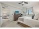 Main bedroom with dresser, TV and access to living room at 43050 Greenway Blvd # 614, Punta Gorda, FL 33982