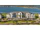 Building exterior showcasing lakefront views and parking at 43050 Greenway Blvd # 614, Punta Gorda, FL 33982