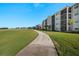 Paved path alongside a golf course, showcasing community at 43050 Greenway Blvd # 614, Punta Gorda, FL 33982