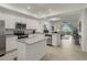 Open concept kitchen with breakfast bar and stainless steel appliances at 43050 Greenway Blvd # 614, Punta Gorda, FL 33982