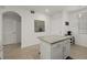 Kitchen island with granite countertops and white cabinets at 43050 Greenway Blvd # 614, Punta Gorda, FL 33982