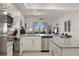 Well-equipped kitchen featuring granite countertops and island at 43050 Greenway Blvd # 614, Punta Gorda, FL 33982