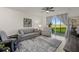 Living area with lake view, comfortable seating and large windows at 43050 Greenway Blvd # 614, Punta Gorda, FL 33982