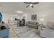 Spacious living room featuring a comfortable sofa and kitchen views at 43050 Greenway Blvd # 614, Punta Gorda, FL 33982