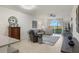 Open living space with view of lake from sliding glass doors at 43050 Greenway Blvd # 614, Punta Gorda, FL 33982