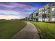 Paved walkway beside residential buildings and golf course at 43050 Greenway Blvd # 614, Punta Gorda, FL 33982