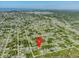 Property location shown with an aerial view of surrounding neighborhood at 7116 Quigley St, Englewood, FL 34224