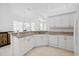 Kitchen with granite countertops and white cabinetry at 7116 Quigley St, Englewood, FL 34224