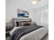 Bright bedroom with king-size bed and neutral decor at 7116 Quigley St, Englewood, FL 34224