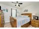 Spacious bedroom with a wooden bed frame and plenty of storage at 7773 Mikasa Dr, Punta Gorda, FL 33950