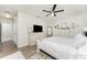 Main bedroom with dresser, large bed, and access to hallway at 7773 Mikasa Dr, Punta Gorda, FL 33950