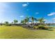 Lush landscaping surrounds the community pool and amenities at 7773 Mikasa Dr, Punta Gorda, FL 33950