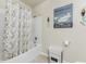 Bathroom with a bathtub, shower, and decorative accents at 7773 Mikasa Dr, Punta Gorda, FL 33950