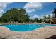 Relaxing kidney-shaped pool with plenty of lounge chairs at 7773 Mikasa Dr, Punta Gorda, FL 33950