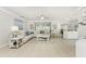 Spacious living room with sectional sofa and large TV at 7773 Mikasa Dr, Punta Gorda, FL 33950