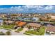 Aerial view of a waterfront home with private dock and lush landscaping at 2736 Magdalina Dr, Punta Gorda, FL 33950