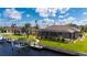 Waterfront backyard oasis with private dock and lush landscaping at 2736 Magdalina Dr, Punta Gorda, FL 33950